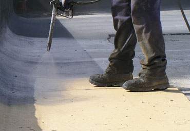 Coating systems over Chicago spray foam roof systems